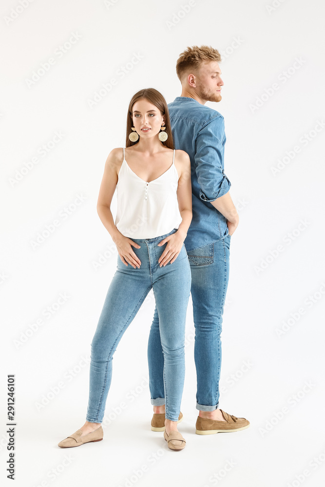 Fashionable young couple in stylish casual clothes on white background Fashionable young couple in stylish casual clothes on white background