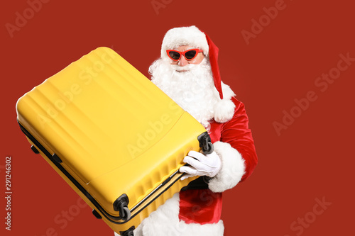 Santa Claus with luggage on...