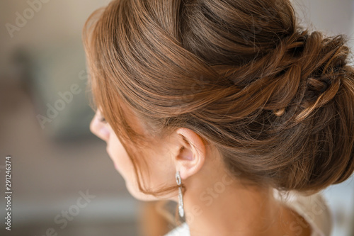 Beautiful young bride with elegant hairstyle