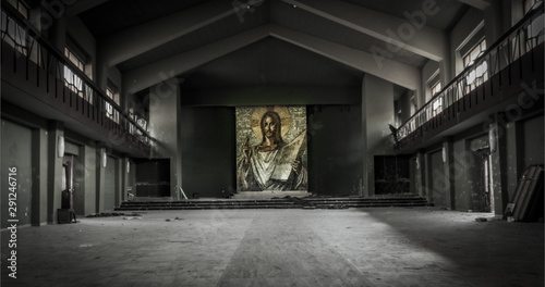 Abandoned church in northern Italy with a very large drawing of Christ in color.