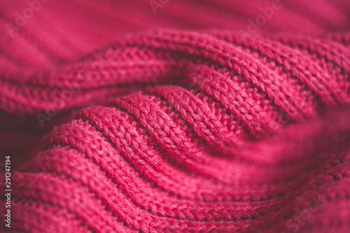 Cotton pink knitted sweater closeup. Winter season.