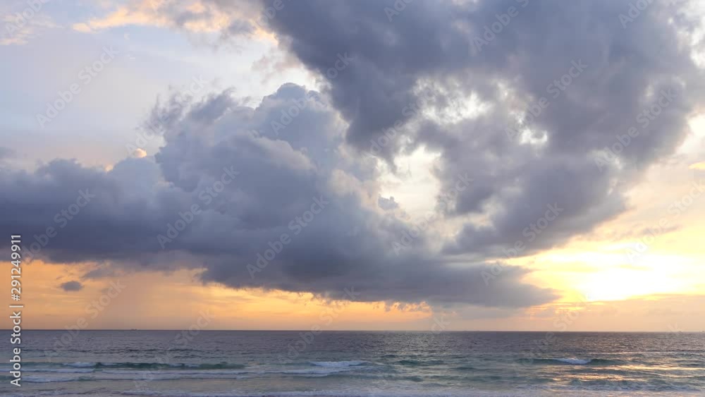 The golden light of the sunset on the phuket beach The golden light of the sunset on the phuket beach
