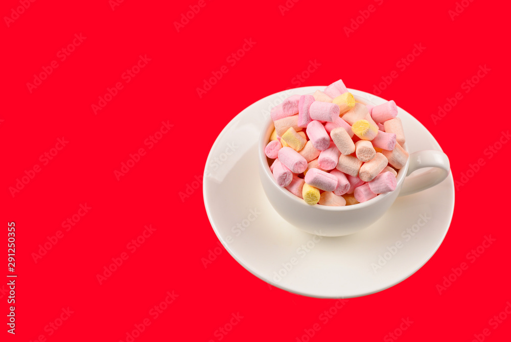 Cup with marshmallow on a red background. Copy space. Cup with marshmallow on a red background. Copy space.