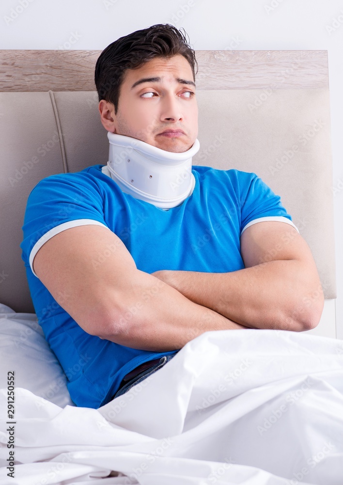 Young man with neck injury in the bed Young man with neck injury in the bed