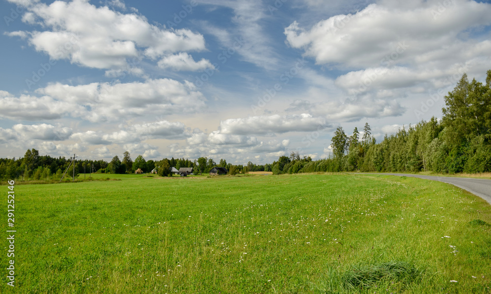 beautiful summer landscape with meadow and lots of clouds beautiful summer landscape with meadow and lots of clouds
