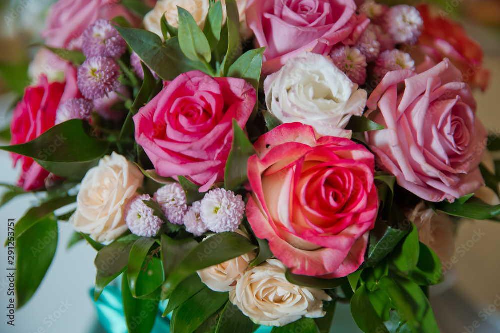 Pink, white, yellow flower bouquet . white, purple roses .Roses with bokeh in the background,Roses for Valentine's Day . Bouquet flower decor for valentine . Purple, white, yellow flowers.