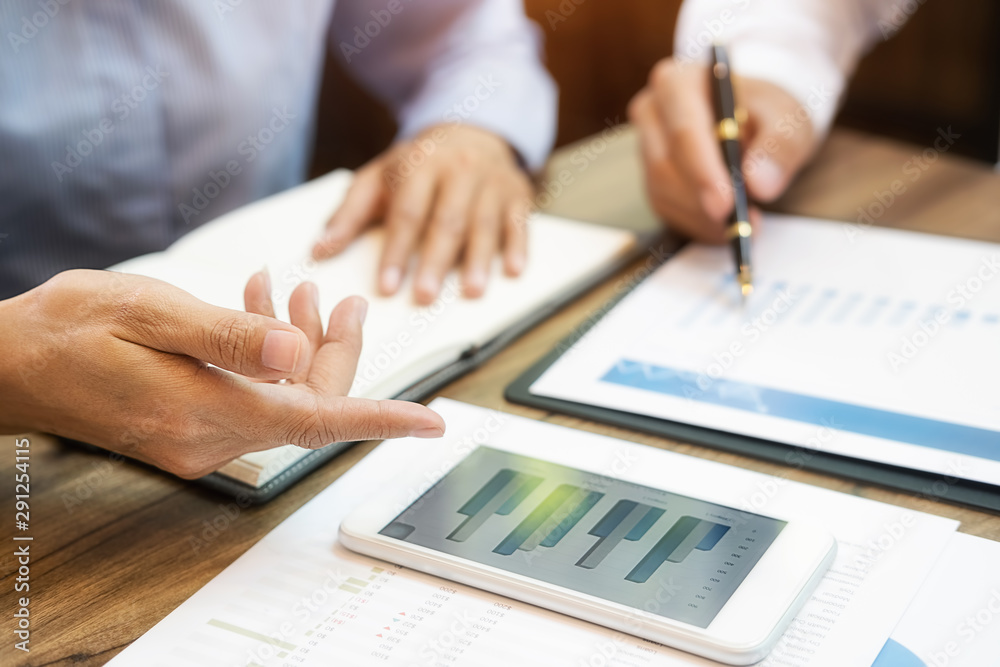 Business team brainstorming and discussing with financial data and report graph. Teamwork meeting working concept. Business team brainstorming and discussing with financial data and report graph. Teamwork meeting working concept.