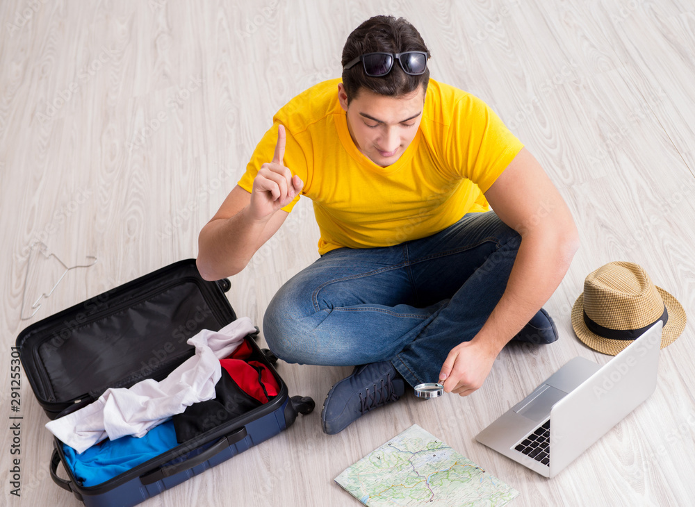 Man planning his vacation trip with map Man planning his vacation trip with map