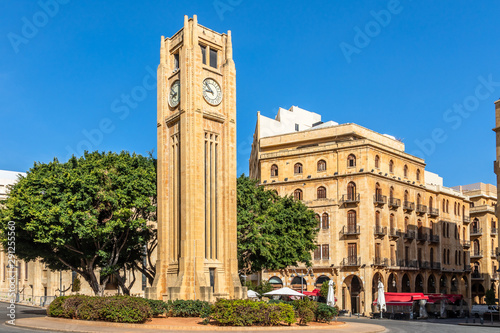Al-Abed Nejmeh Square clock tower with tree and buildings around, Beirut, Lebanon
