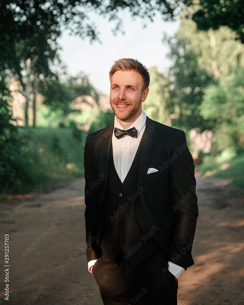 portrait of a happy groom on the background of nature portrait of a happy groom on the background of nature