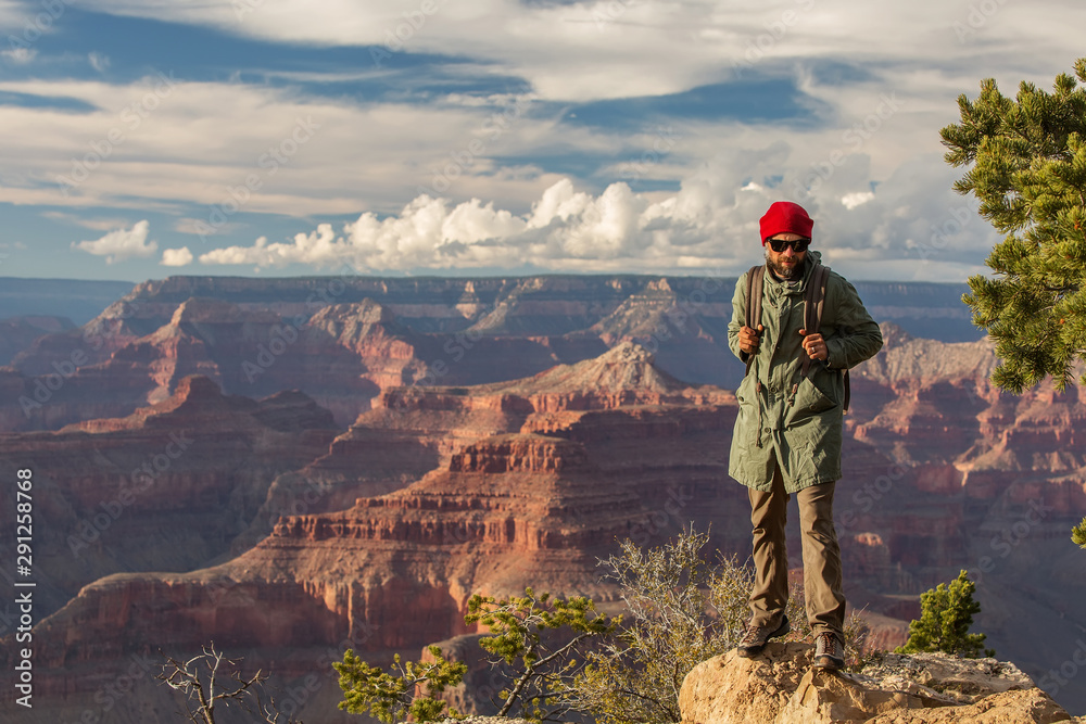 A hiker in the Grand Canyon National Park, South Rim, Arizona, USA. A hiker in the Grand Canyon National Park, South Rim, Arizona, USA.