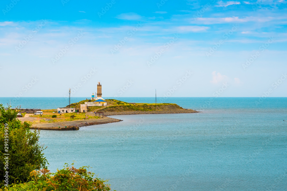 Lighthouse on the black sea coast on the Peninsula. Seascape