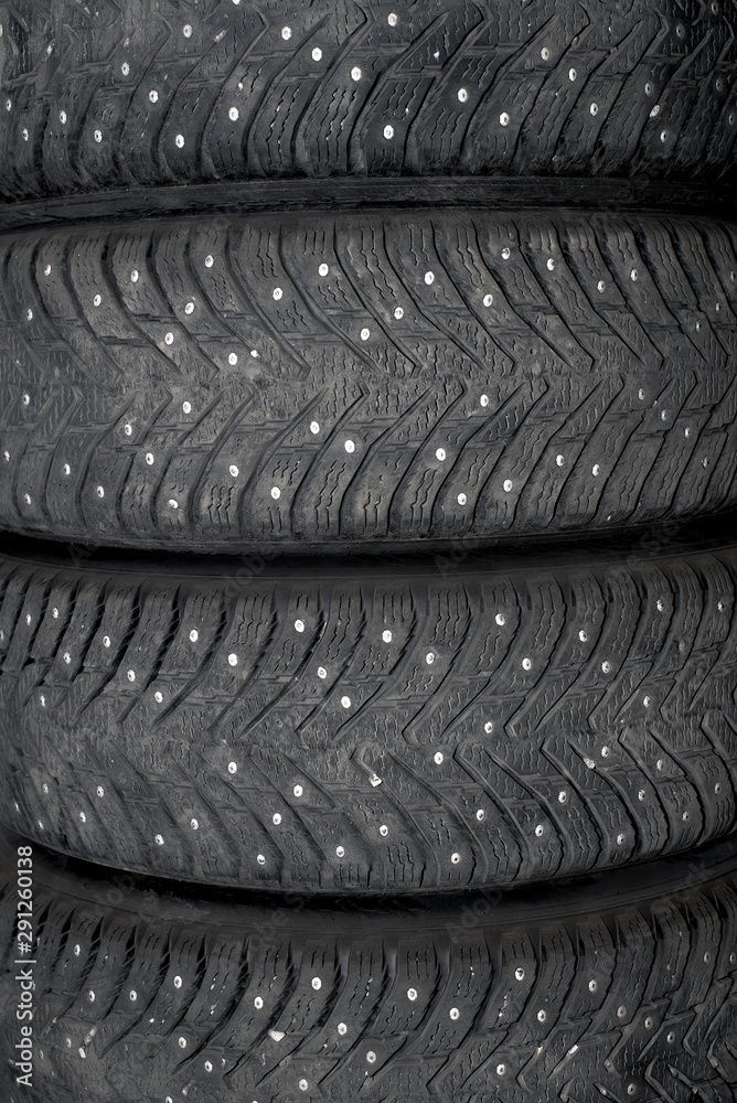 Obraz premium Winter studded rubber. Four studded wheels.