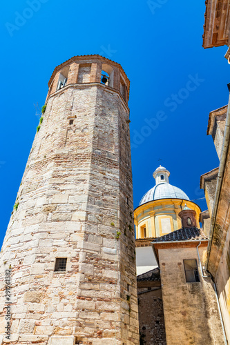 The dome of the cathedral of the city of Amelia with the dodecagonal tower, in Umbria. The crucifix on the top. The Roman-Gothic church of Sant'Agostino. photo