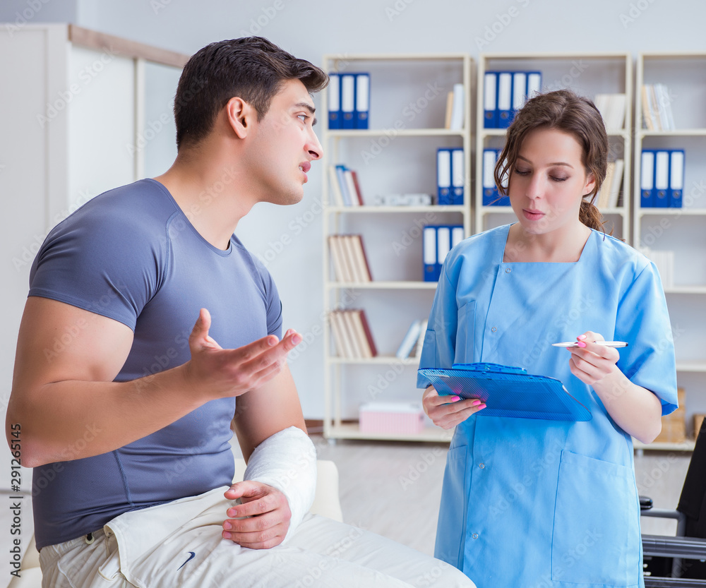 Fototapeta premium Doctor and patient during check-up for injury in hospital