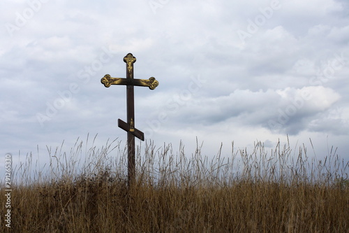 Christian cross on blue sky background