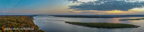 Aerial panoramic landscape  view on Volga river with small sand islands and colorful green  orange and yellow forest during autumn evening  Samara  Russia 