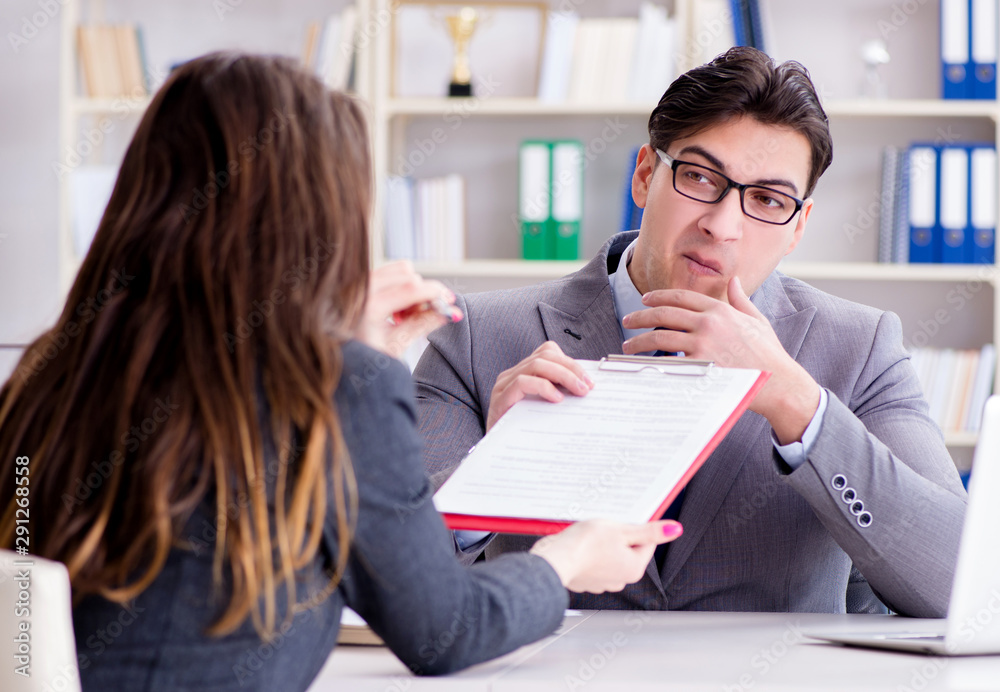 Business meeting between businessman and businesswoman Business meeting between businessman and businesswoman