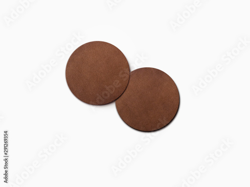 two dark brown leather coaster