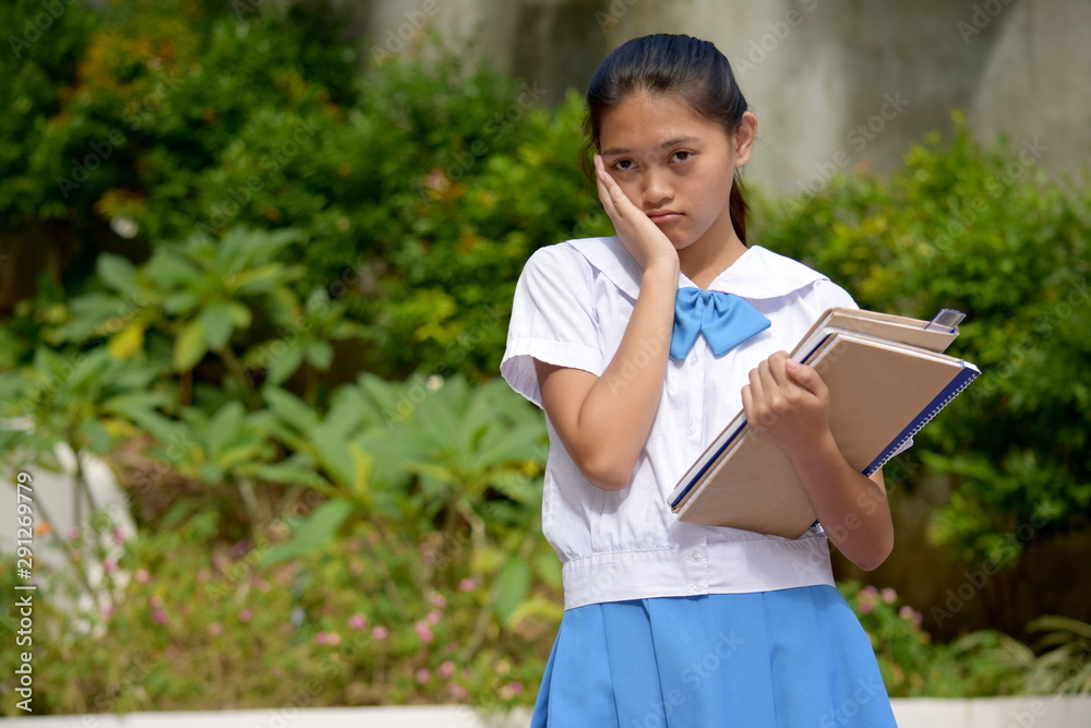 Depressed Filipina Female Student With School Books Depressed Filipina Female Student With School Books