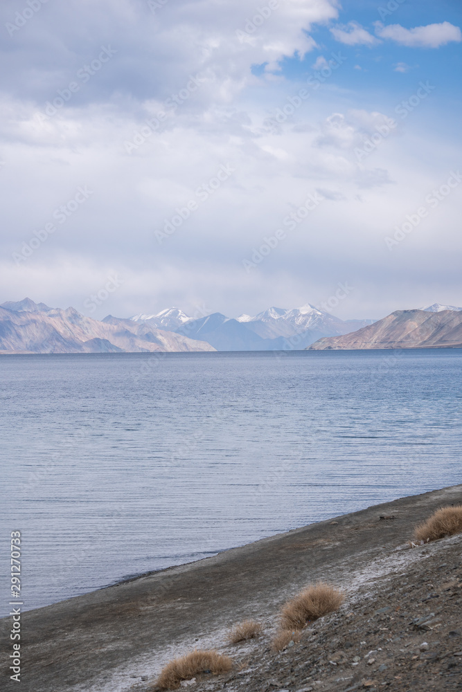 Pangong Lake with rocky mountains situated on the border with India and China in Ladakh region Pangong Lake with rocky mountains situated on the border with India and China in Ladakh region