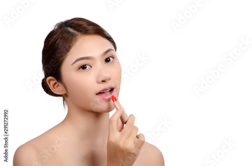 Portrait of Beautiful Asian women With Applying Lip on white background