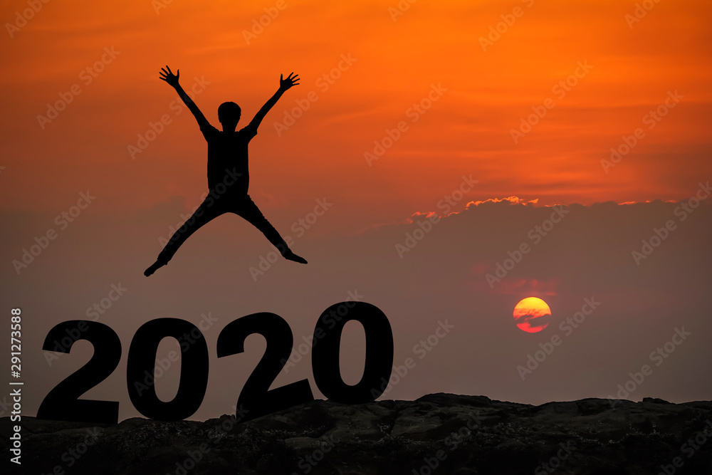 Silhouette of young man happy jumping and hand up between 2020 new year, sky and sun light background. copy space for text. Future and time passing concept. Silhouette of young man happy jumping and hand up between 2020 new year, sky and sun light background. copy space for text. Future and time passing concept.