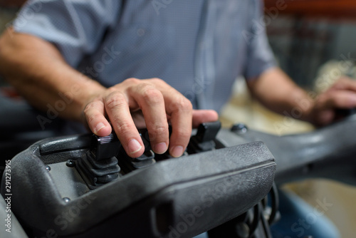 close up of factory heavy equipment hands operator