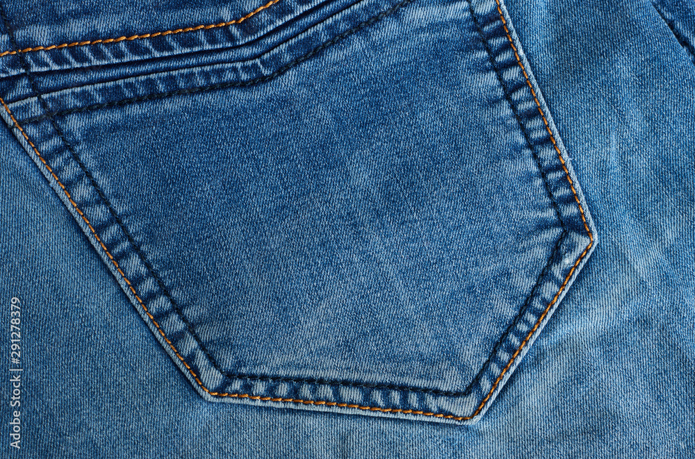 Fragment of blue denim with a pocket. Fragment of blue denim with a pocket.