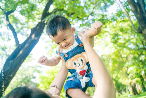 Happy laugh baby boy throw by mother hand © themorningglory