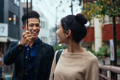 Happy japanese couple dating outdoors in Tokyo