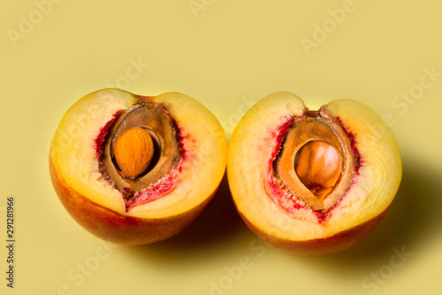Nectarine, peach on a yellow background. copy space