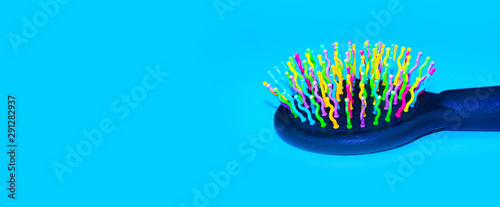 comb on a blue background. copy space
