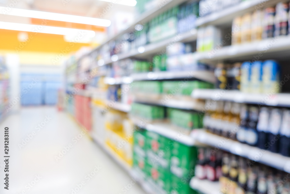 Bokeh blurred supermarket store with various goods on shelf