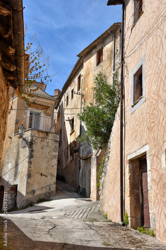 A narrow street between old buildings in the medieval town of Alvito, in the Lazio region of Italy
