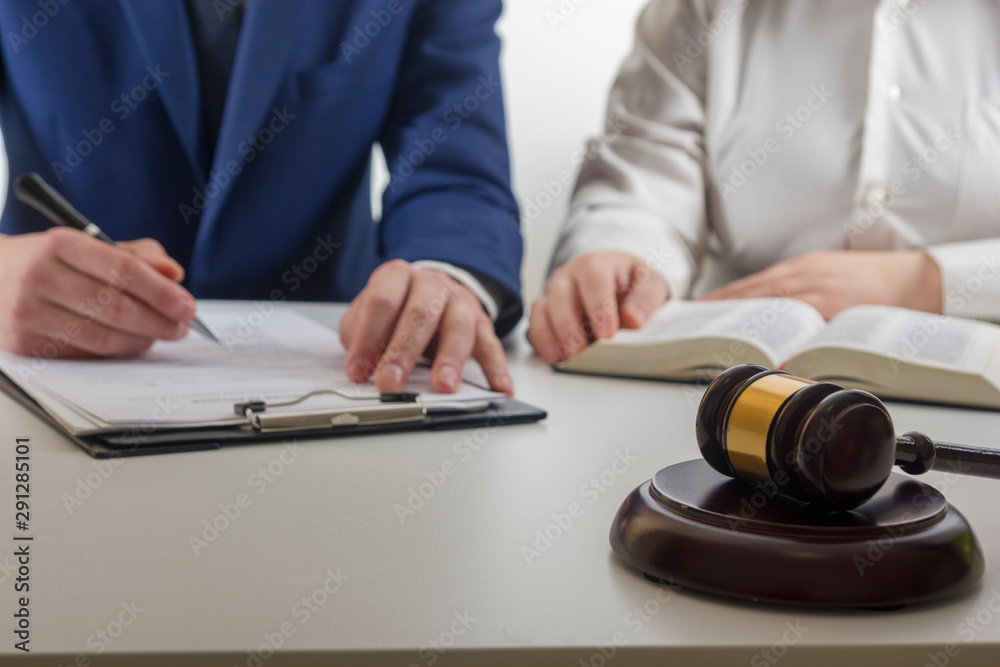 Law, advice and Legal services concept. Lawyer and attorney having team meeting at law firm. Law, advice and Legal services concept. Lawyer and attorney having team meeting at law firm.