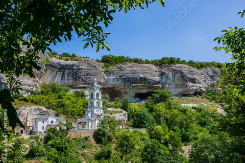 Monastery in the mountains among the rocks photo