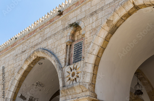 Suran from the Koran above the entrance to the Al Aqsa Mosque on the territory of the interior of the Temple Mount in the Old City in Jerusalem, Israel