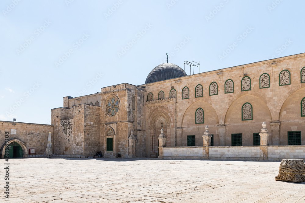 The dome and part of the wall of the Al Aqsa Mosque on the territory of the interior of the Temple Mount near the Maghrib Gate in the Old City in Jerusalem, Israel