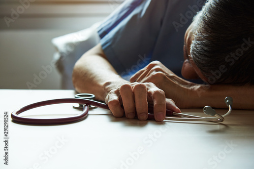 An adult male burnout doctor feeling tired 