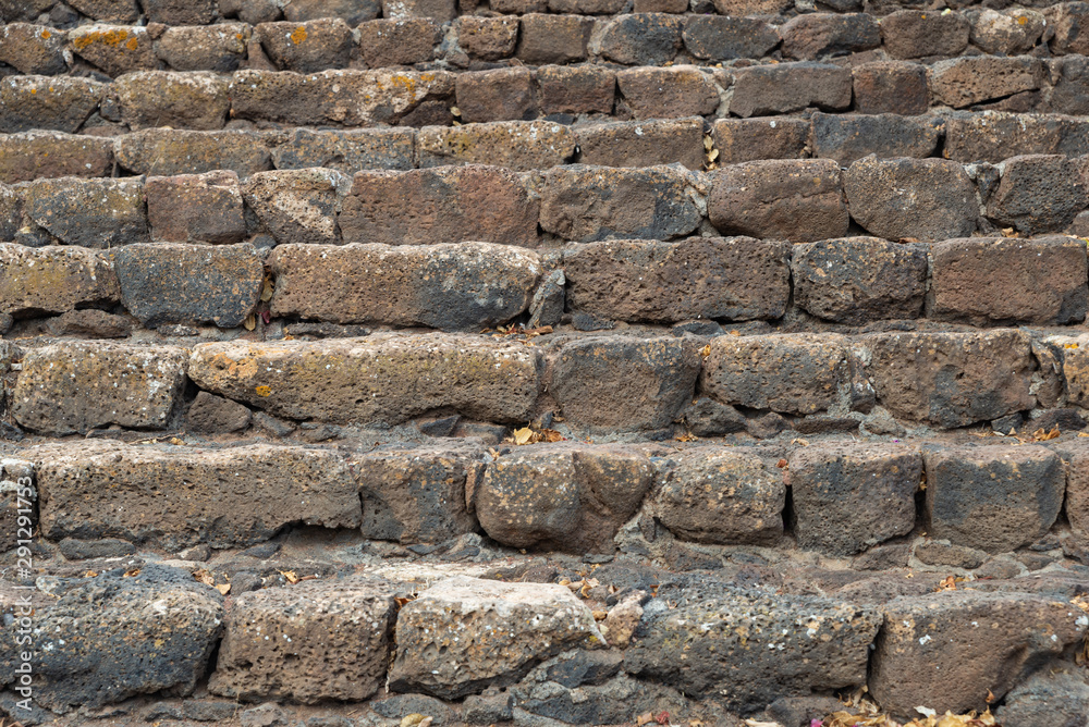 Old stone stairs background with a lot of items.