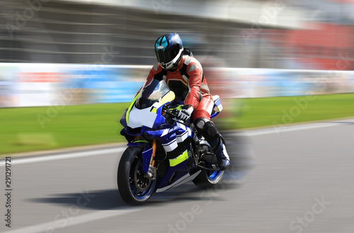 Racer on a sports bike rides on the race track
