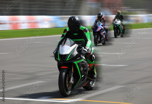 Motorcycle racers compete on the race track