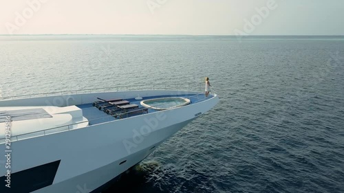 Woman on luxury private yacht in maldives ocean photo