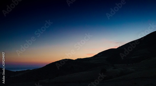 Silhouette of mountains on the island of Crete at dusk, Greece