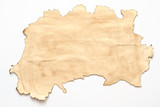Old brown paper with burnt edge on white background. Vintage abstract design. Copy space.