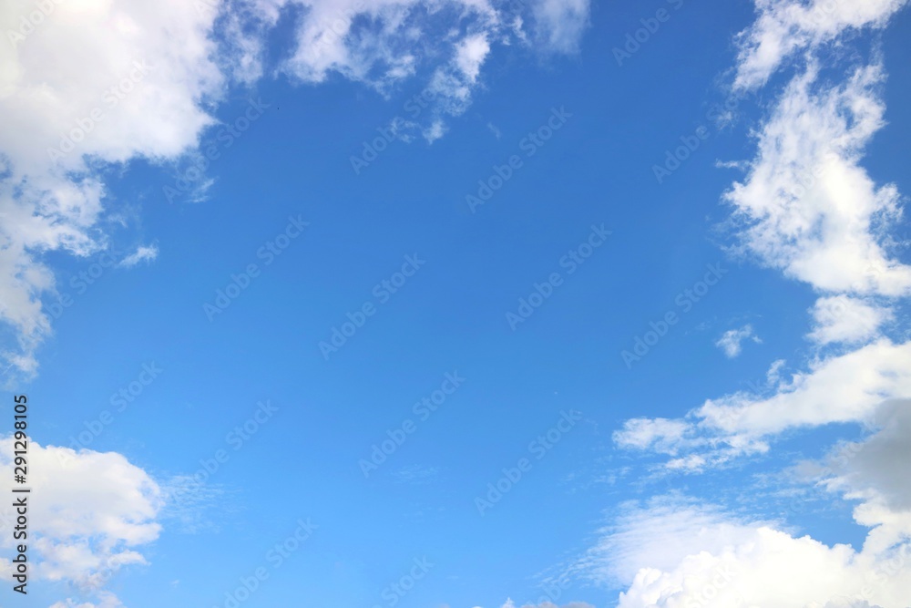 Clear blue sky with white clouds in summer time. Nature background concept. Clear blue sky with white clouds in summer time. Nature background concept.