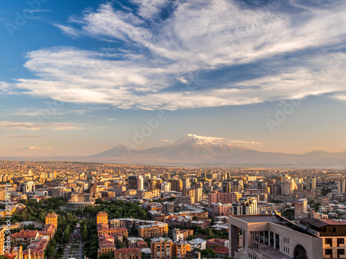 Yerevan city at sunset seen from the top of Cascade with magnificent Mount Ararat in the background.