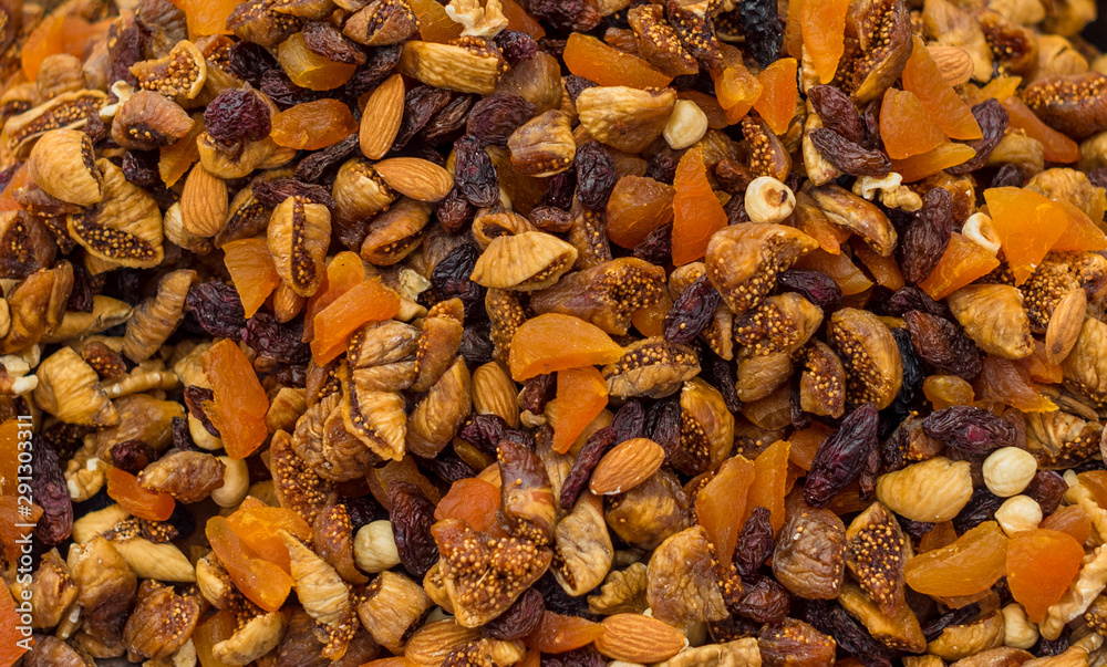 Mix of dry nuts and fruits close up Mix of dry nuts and fruits close up