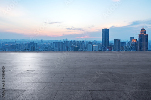 Panoramic skyline and buildings with empty concrete square floor
